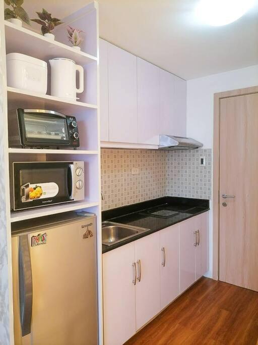 كويزون سيتي Cozy Studio Unit At Sun Residences المظهر الخارجي الصورة